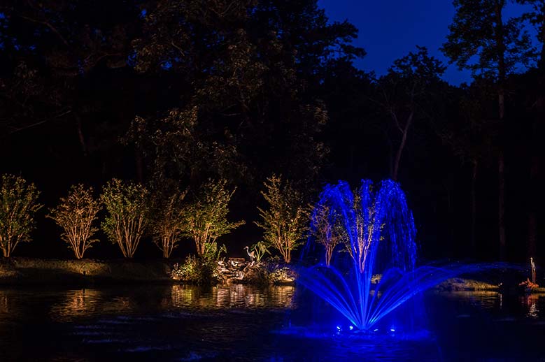 Fountain with blue light at night
